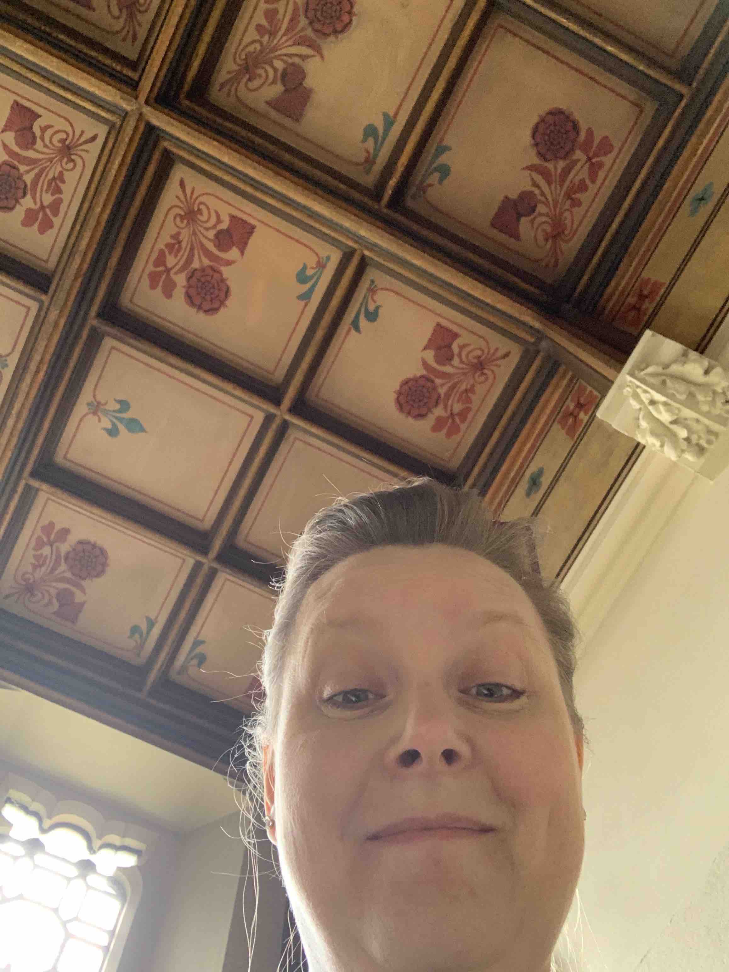 Selfie with the painted zinc ceiling of  the Maughan Library in the background