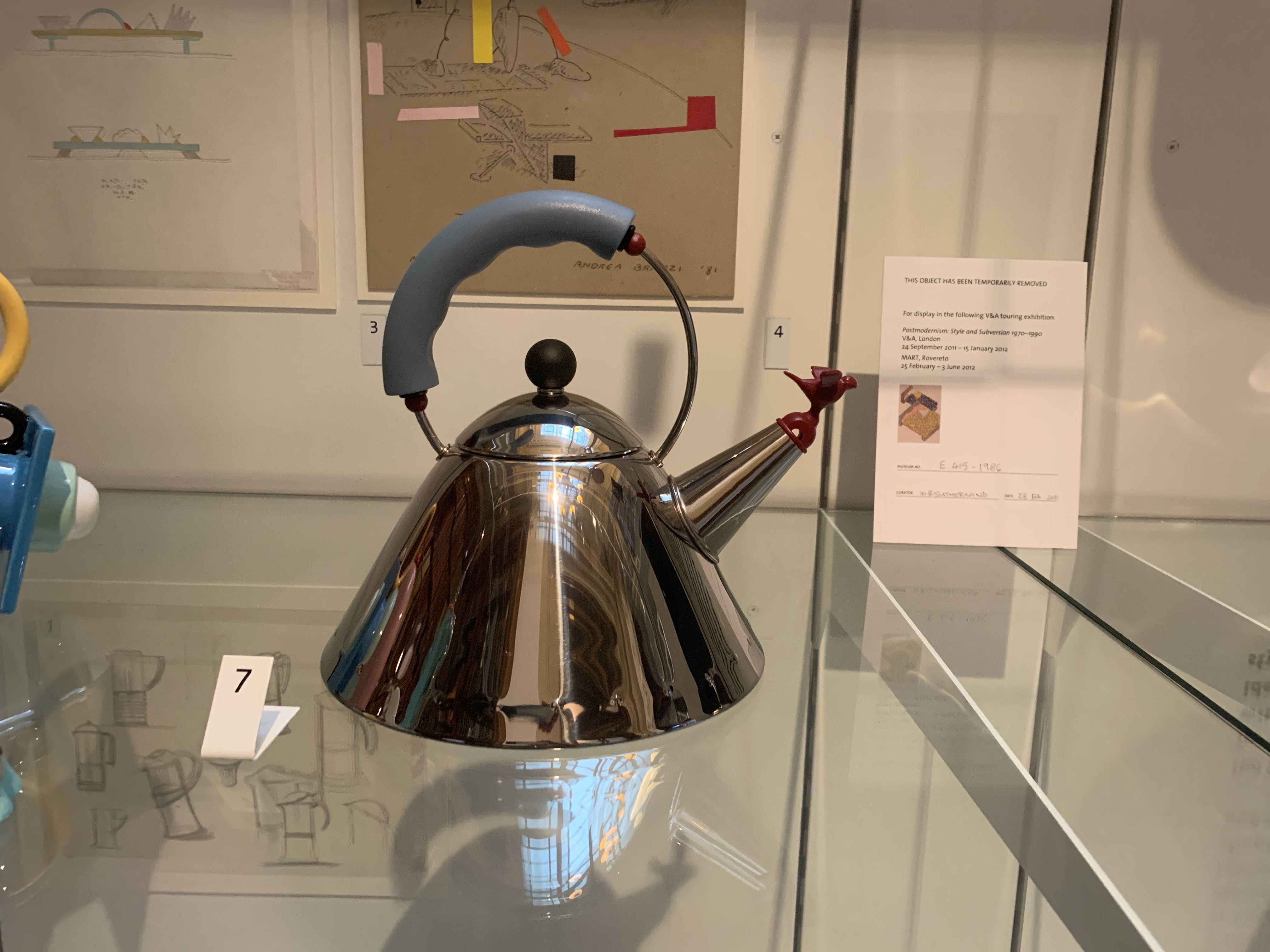 Image of a modern designed stainless steel teakettle by Michael Graves