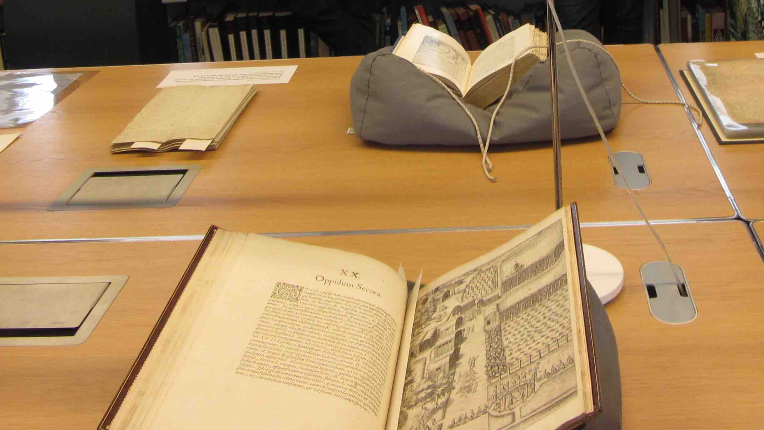 Cropped image of objects from Caird Library and Archive on the table